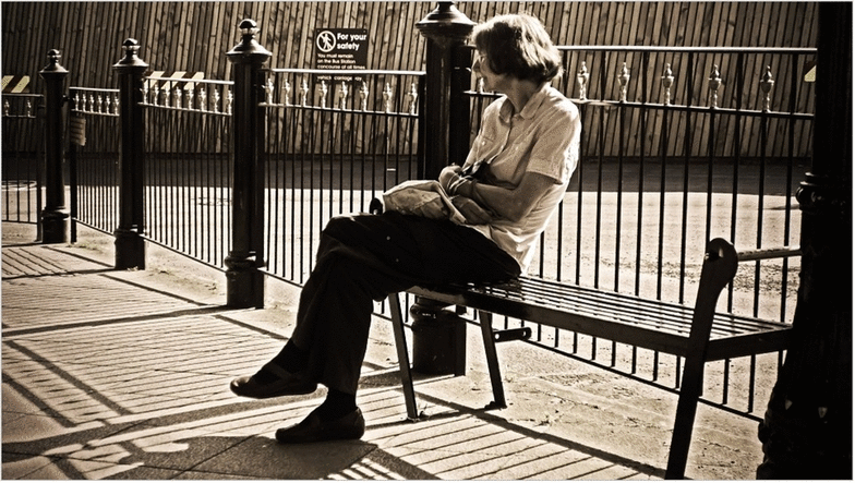 Lady Sitting Photo Showing Focal Point